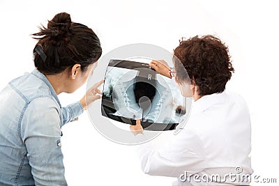 The doctor discusses with the patient with the patientâ€™s neck X-ray Stock Photo